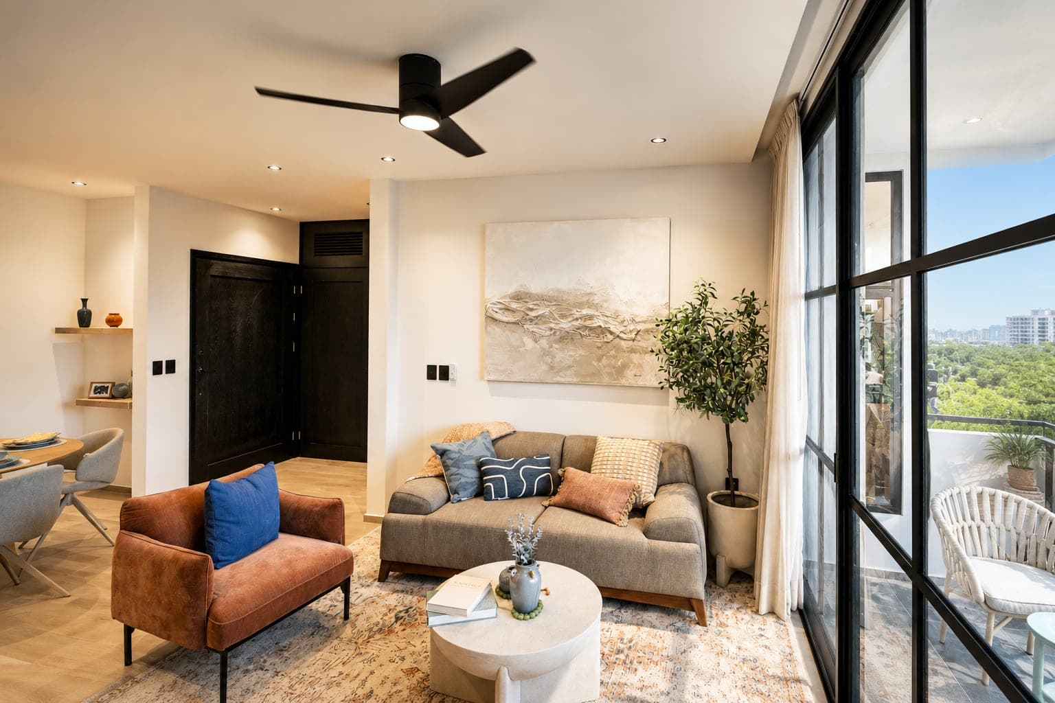 Living room in a Múrex residence, with the sliding door to the terrace